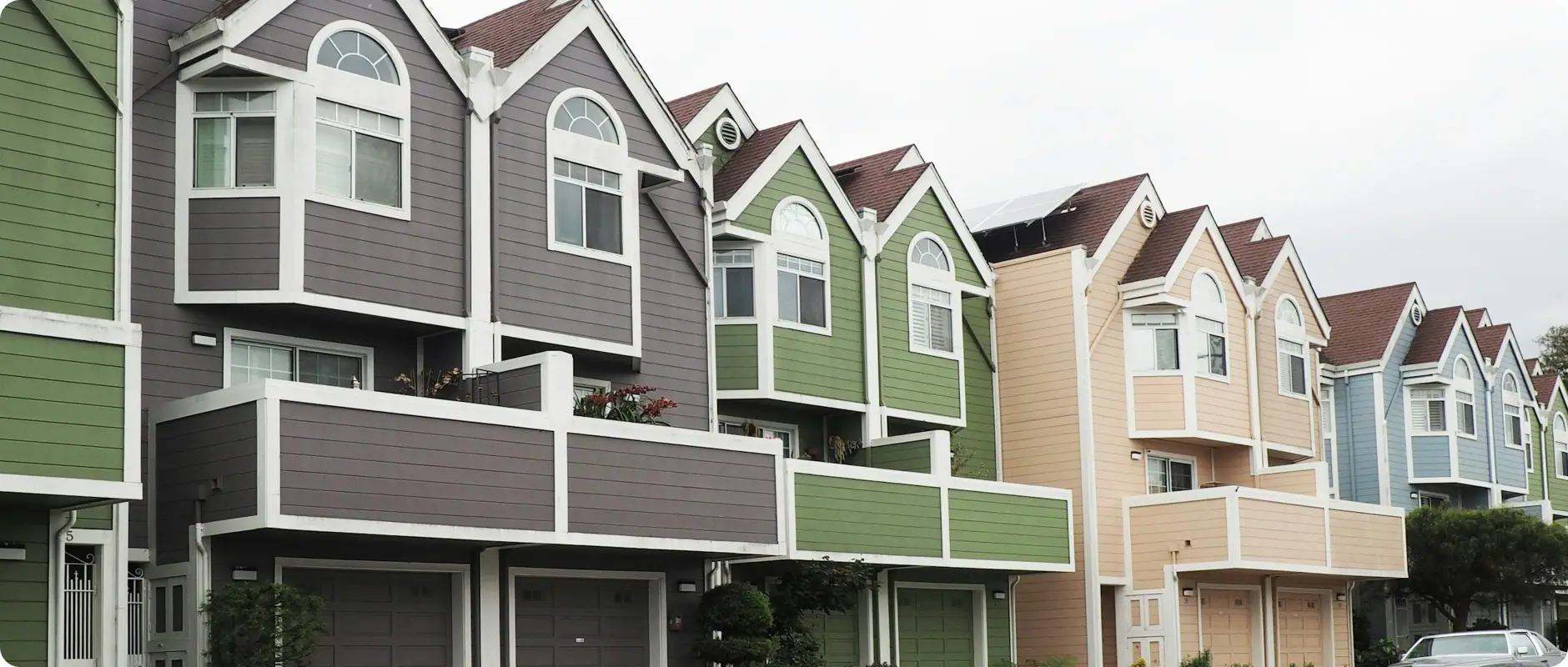 A terrace of let houses in green, grey and cream, the kind of portfolio a LANDLUST manager runs
