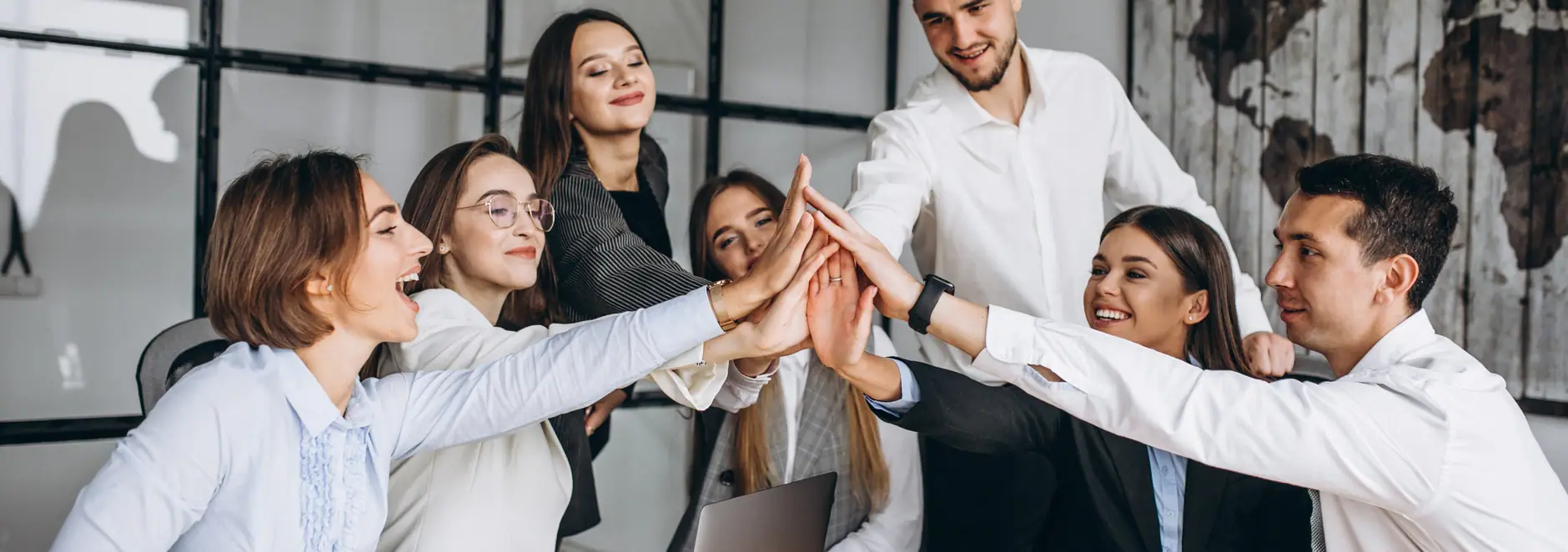 Colleagues celebrating together in an office, the people a WorkHub HR platform is built for