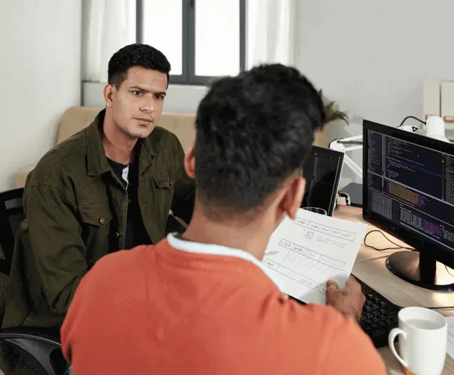 Devoq Design researchers synthesizing interview findings